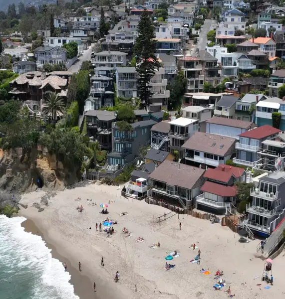 Aerial view of premium beachfront homes in Laguna Beach, symbolizing the high-value real estate protected by our elite family law attorneys for affluent clients.