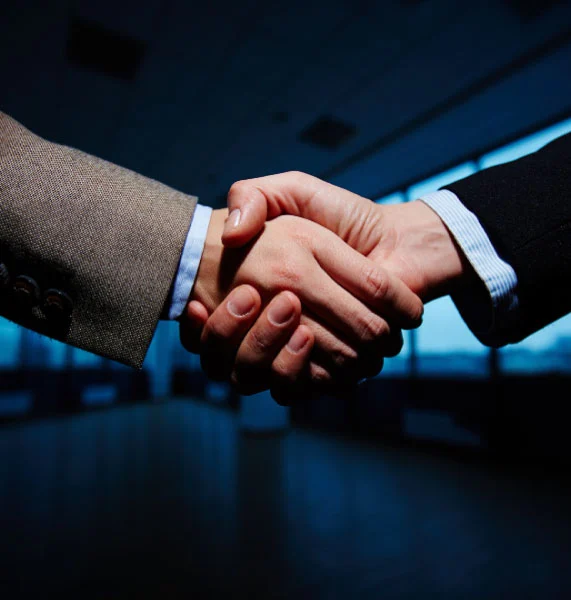 Professionals shaking hands after successful family law dispute resolution in Orange County
