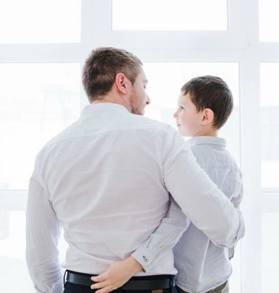 A father holding his young son, representing child custody and parental rights protected by an Orange County child custody lawyer.