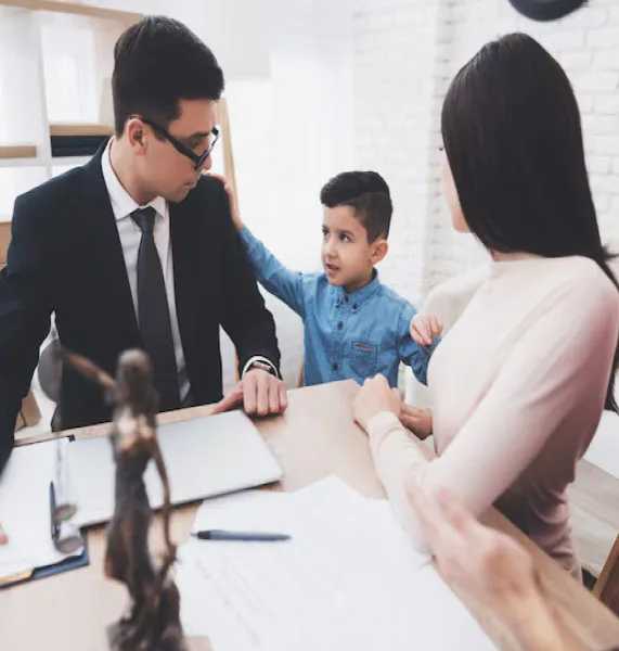 A mother, father, and young child during a family law consultation representing paternity rights and child support in Orange County.