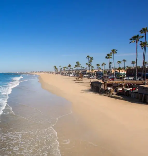 Sunny beachfront view in Newport Beach, representing the exclusive coastal communities served by our top-rated divorce attorneys handling high-net-worth cases.