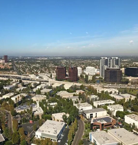 Aerial view of the Costa Mesa business district and skyline, representing the local area served by Garelick Family Law, your premier family law attorney in Costa Mesa.