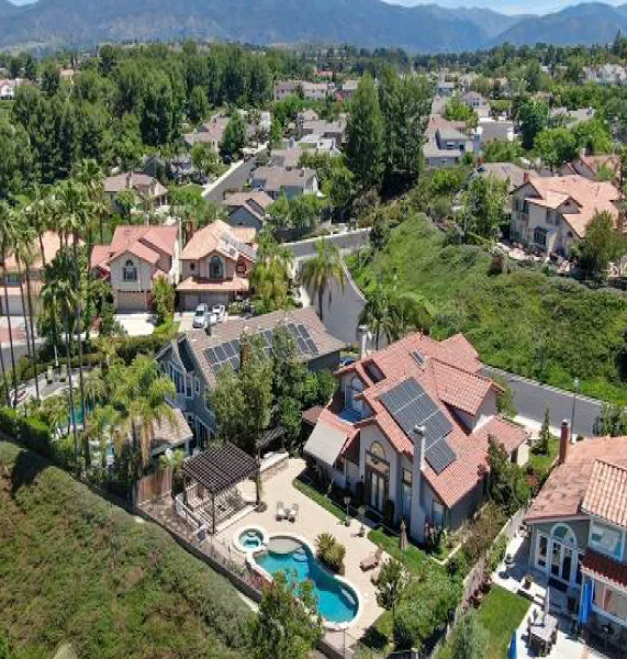 Aerial view of a beautiful residential neighborhood in Mission Viejo, California with large homes and mountain views.